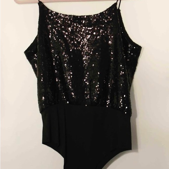 Santa Maria

Colombian brand
Sequin bodysuit in perfect condition - Picture 2 of 3